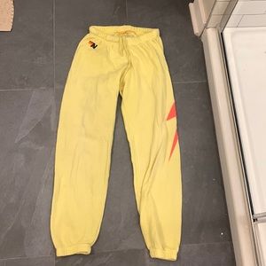 Aviator nation highlighter yellow sweatpants lightening bolt on side